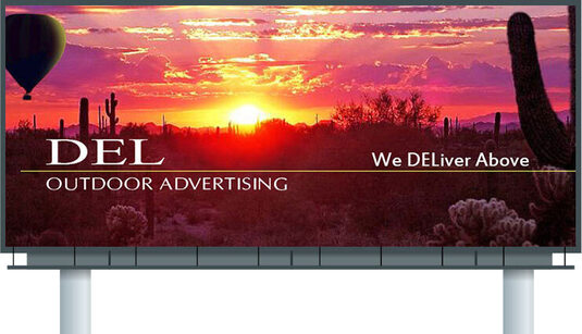 Interstate billboard on two poles showing the Del Outdoor Advertising desert sunset design
